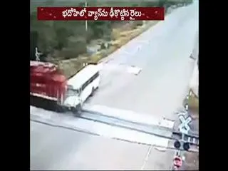 Seven children dead after their van hit a train at an unmanned level crossing in Bhadohi - Sakshi
