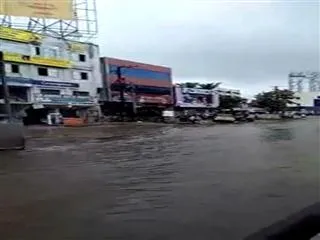 Rains Ravage City Roads; Traffic Standstill On Highway Near Kukatpally - Sakshi