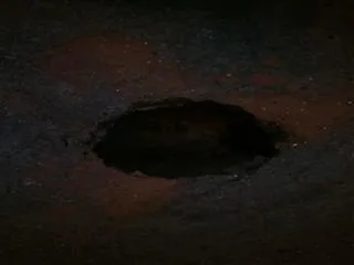 big hole on busy road at ameerpet, Hyderabad - Sakshi