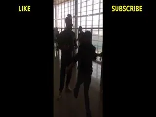 Yuvraj Singh and Hazel Keech perform `bhangra` at Goa airport - Sakshi
