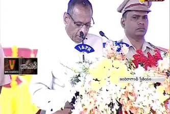 Governor ESL Narasimhan Hoists Flag at Indira Gandhi Municipal Stadium - Sakshi