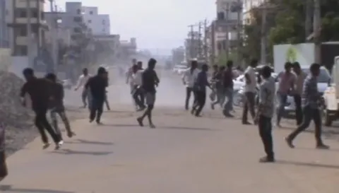 Youth creates Violence in front of penamaluru police station - Sakshi
