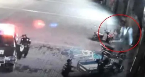 Hero Cop Catches Woman Falling Off Building In China - Sakshi