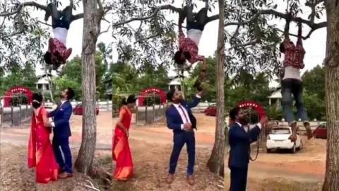 Photographer Hangs From Tree To Click Pics - Sakshi