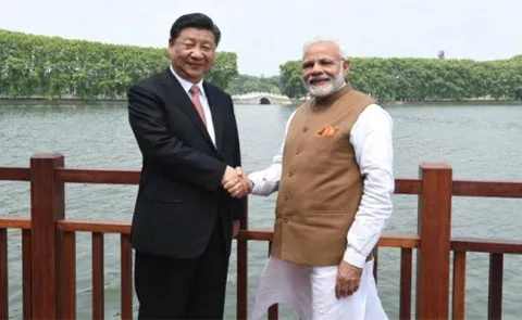 PM Modi, Xi Jinping agree to undertake joint economic project in Afghanistan - Sakshi