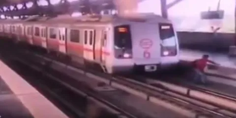 Metro Driver Saves Man Crossing Tracks In Delhi Metro Station - Sakshi