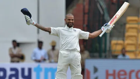  Dhawan hits rare century - Sakshi