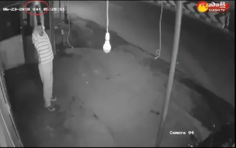 Coimbatore- A Man Stolen Bulb On Footpath  - Sakshi