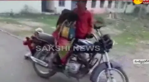 Madhya Pradesh Man Carries Mothers Body On Bike For Postmortem - Sakshi