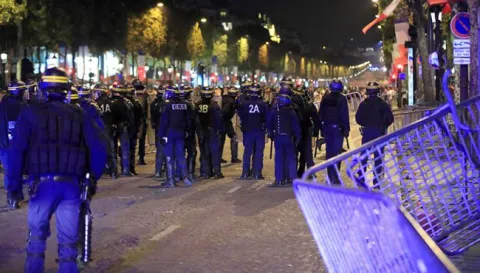 French fans clash with police after defeating Belgium in World Cup - Sakshi