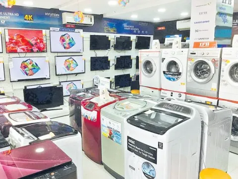 GST on refrigerators, washing machine reduced to 18 percent - Sakshi