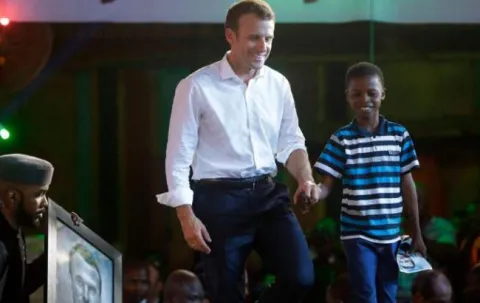 The 11-year-old Nigerian artist who moved President Macron - Sakshi