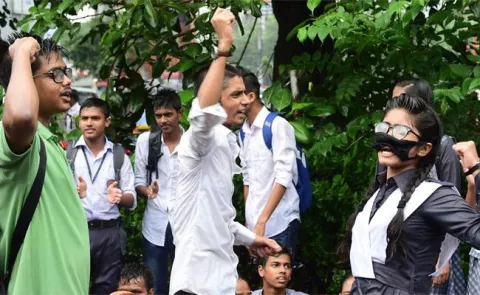 angry students have taken over police duties in Dhaka - Sakshi