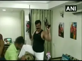 Drunk BJP MLA flaunts guns, dances at a party - Sakshi