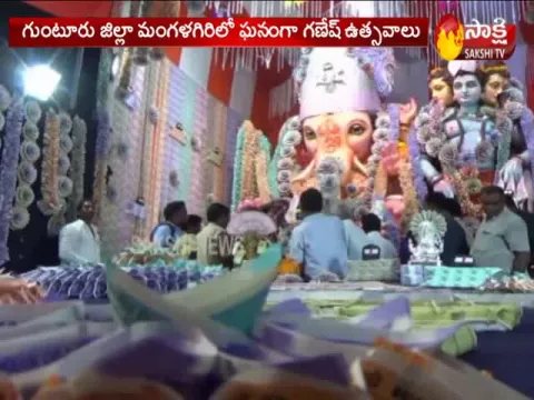 Ganesha idol decorated with currency notes at Guntur