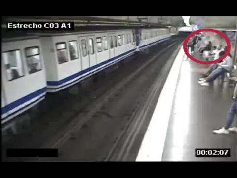 Woman falls onto subway tracks while checking her phone