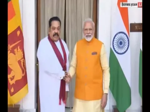 Narendra Modi And Mahinda Rajapaksa Meet With Each Other In Delhi - Sakshi