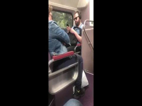 Woman deliberately coughing at a man on a train in Australia