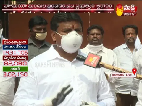 Vempalli Srinivas Distributes Homeo Medicine in Vijayawada