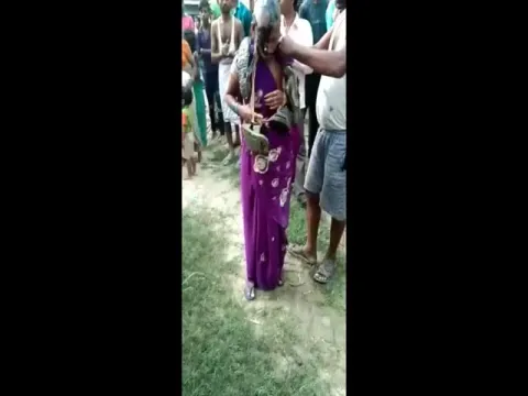 Woman And Man Shamed With Garland 