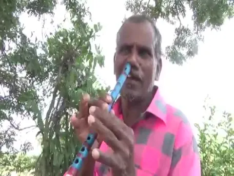 Man Plays Flute With Nose
