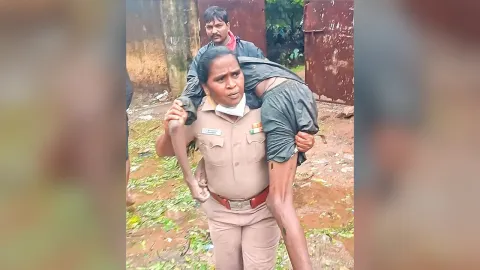 Woman Cop Carries Unconscious Man On Her Shoulders Amid Chennai rains
