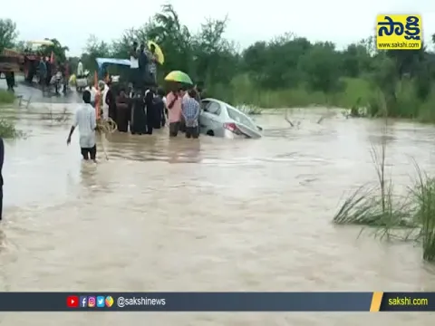 Car Washed Away In Floods At Warangal