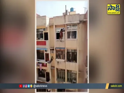 Viral  Video : Woman Stands On The Edge Of Window