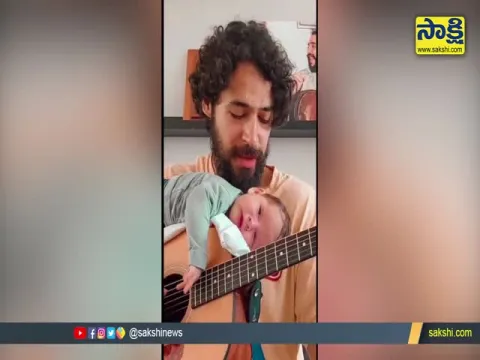 Baby slept On Father's Guitar Video Goes Viral