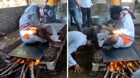 Viral Video Baba Giving Blessings To Devotees Sitting On The Burning Stove