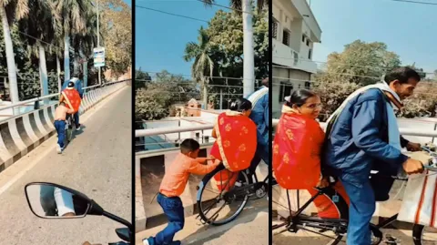 Viral VIdeo Kid Pushing Bicycle When Father Paddling On A Bridge