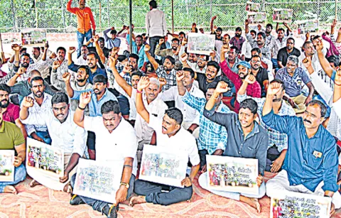 Ration delivery vehicle drivers protest at Dharna Chowk in Vijayawada
