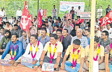 Ration vehicle drivers protest at Vijayawada Chowk for second day