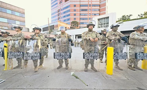 Protests against immigration raids spread across US