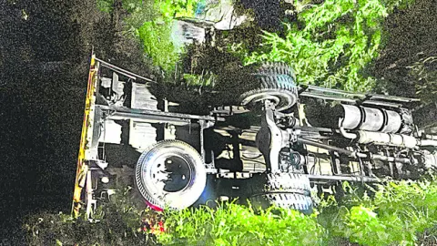 వాగులో లారీ బోల్తా 