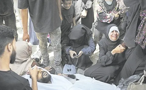 Officials say 85 Palestinians seeking aid are dead in Gaza as Israel widens evacuation orders