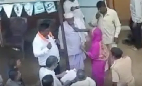 women drags husband infront of jarkiholi for ditching 