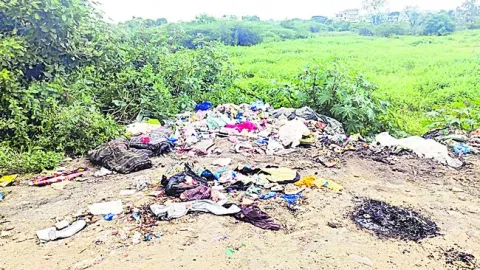  Piles of garbage on the side of the road in Ramayampet town