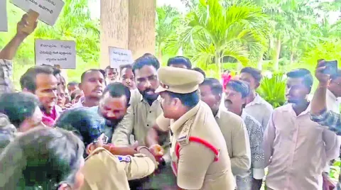 పెట్రోల్‌ బాటిళ్లతో ప్రజావాణికి..
