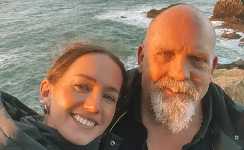 we travel together, and I call him my second dad