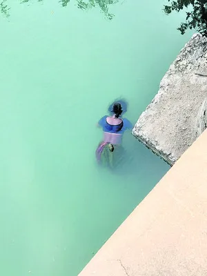 వాగులో దూకిన తల్లీ కొడుకు..