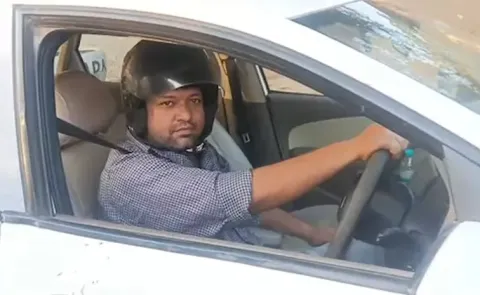 UP Man Drives Car Wearing Helmet After Being Fined For Not Wearing One