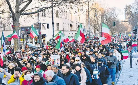 Iran warns it will retaliate if US attacks as protesters defy crackdown