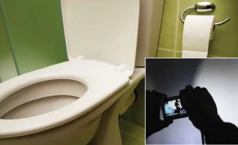 Cop Films Woman Colleague In Toilet
