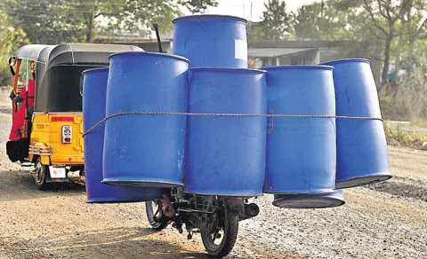 bike rider carries eight drums peddapalli funny viral photo