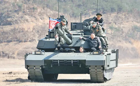 Kim Jong Un Tries New Battle Tank With Daughter Ju Ae