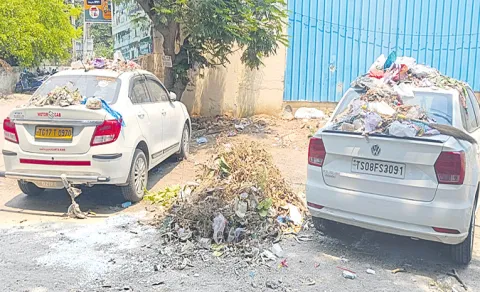 cars block garbage clearance quthbullapur ghmc dumps trash on vehicles