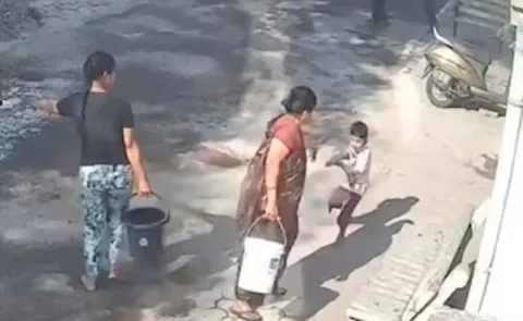 Woman throws scalding hot water on grandson