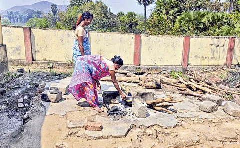 Food Preparing On Wood Stove to students: Andhra Pradesh