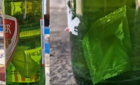 Condom Packet In Beer Bottle
